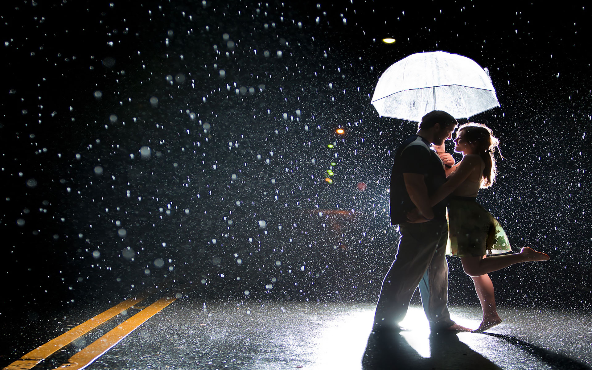Joy of couple on a rainy street